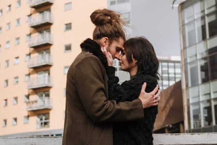 Loving couple cuddling on street