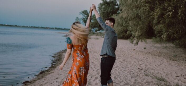 Couple dancing by the beach