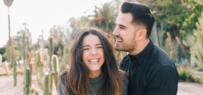 A couple hugging and laughing