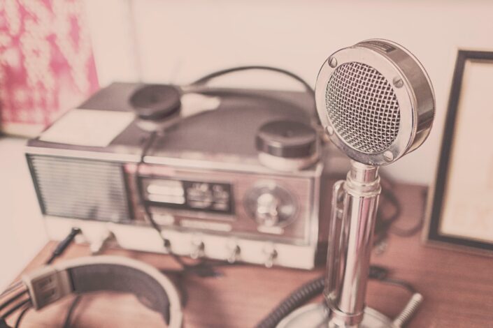 Classic grey stainless steel cb radio on brown wooden table