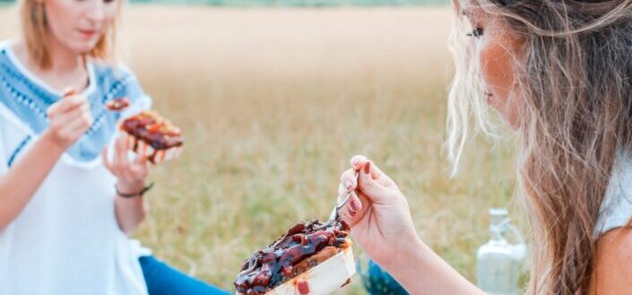 Two women enjoying a picnic