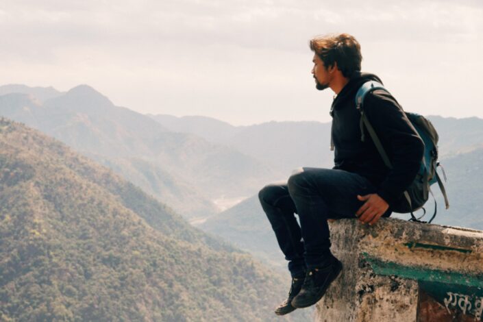 Man looking at the mountains