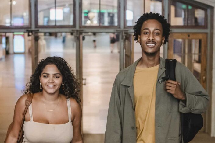 Couple smiling together, on for a travel.