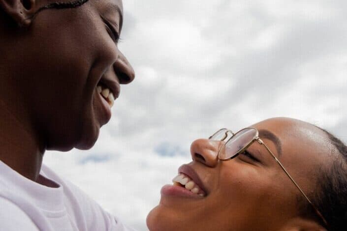 A couple looking at each other while smiling