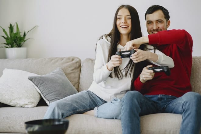 Couple flirting over video game controller - video game pick up lines 