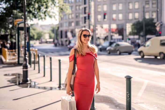 Woman wearing red dress and sunglasses