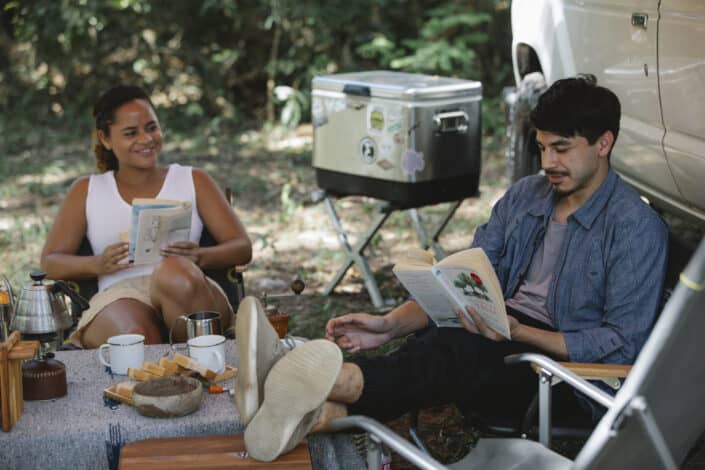 Couple reading books happily together