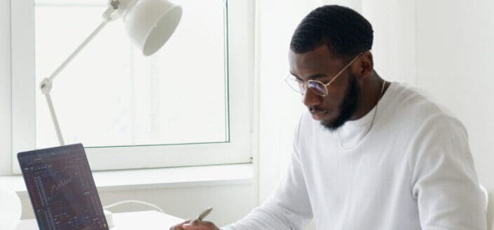 man studying on his desk