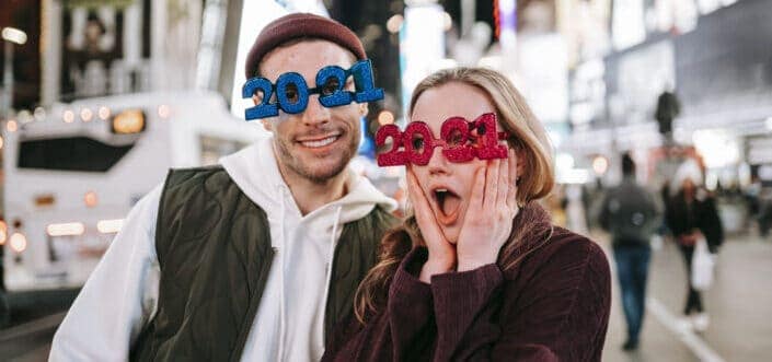 couple wearing 2021 decorated eyeglasses