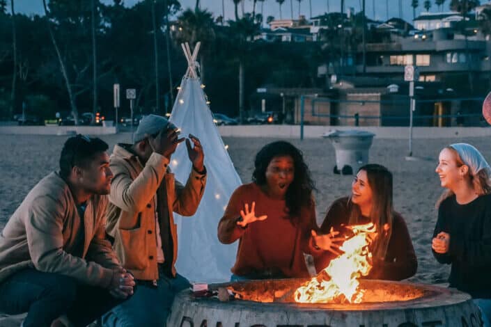 Friends gathered around a bonfire
