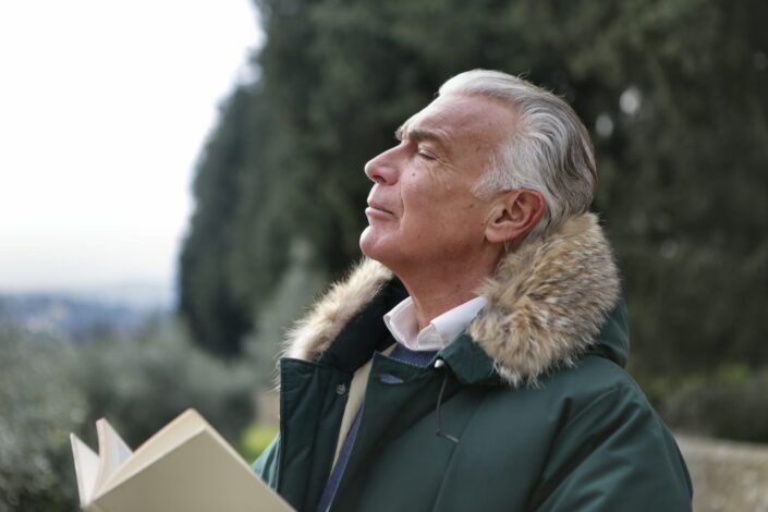 Man in green and brown jacket