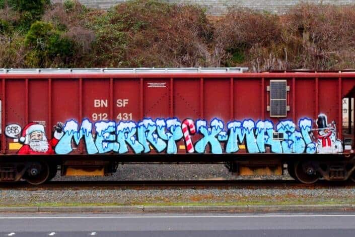Railroad car with Merry Christmas, Santa and snowman graffiti