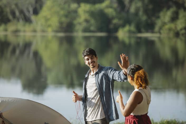 couple giving high five to each other 