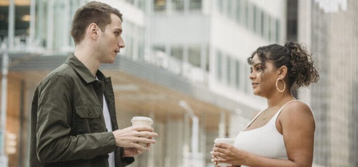 Young diverse coworkers having coffee break together