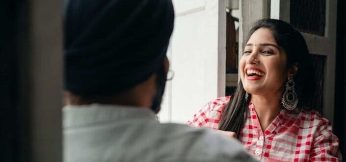 Girl laughing while talking to a guy