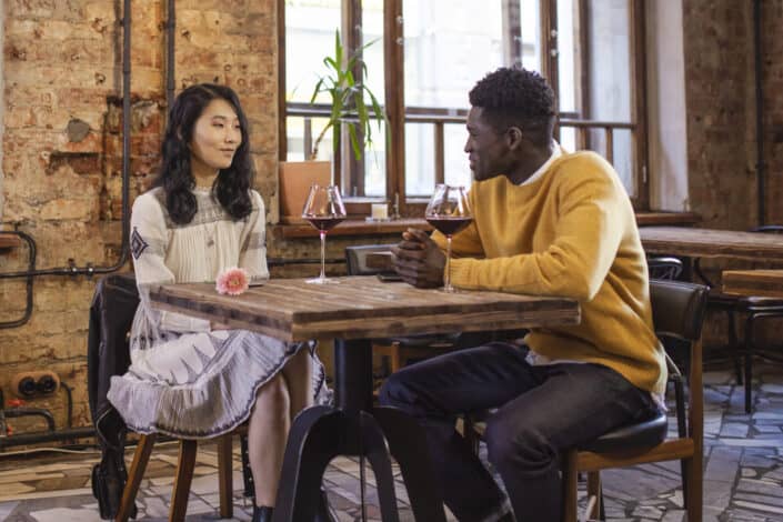 man and woman having casual date in restaurant