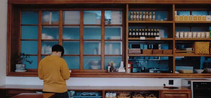 A man sitting inside a restaurant