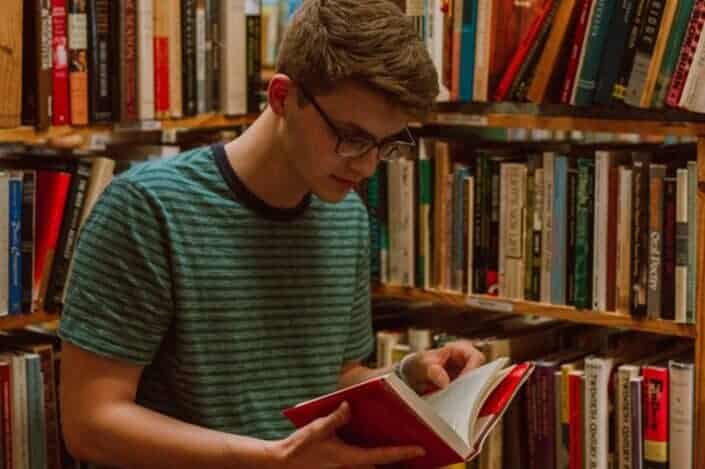 A young man reading a book