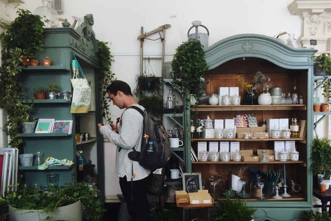 Guy choosing what to buy in the store - things to collect