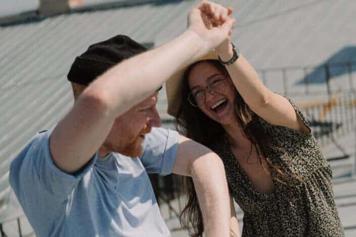 cheerful couple dancing playfully