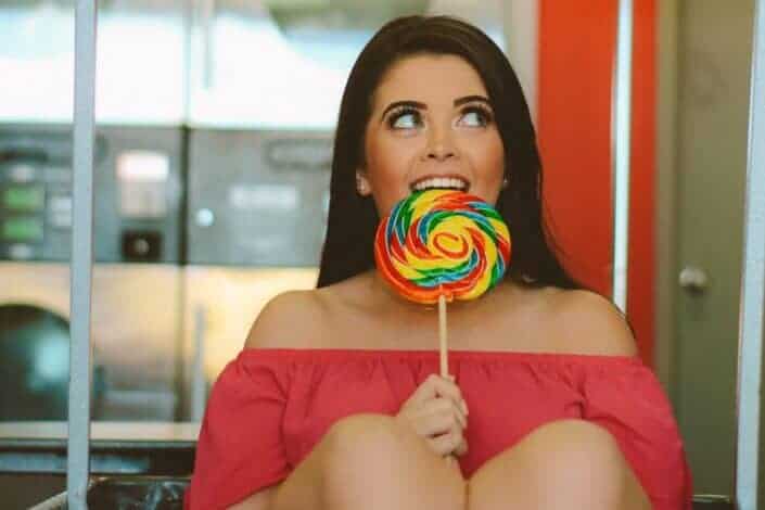 lady eating large lollipop