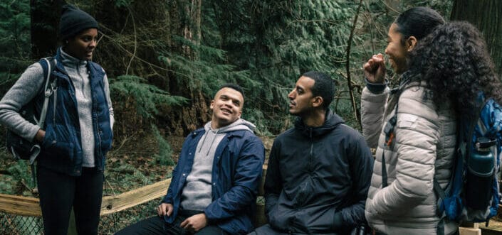 Friends talking while on a hiking break