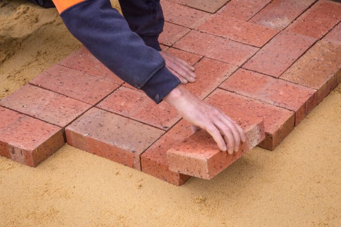 a person laying bricks