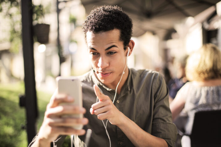 man video chatting with someone outside