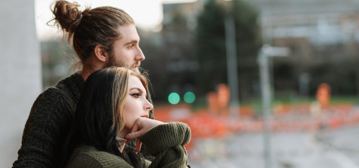 couple embracing each other at the balcony