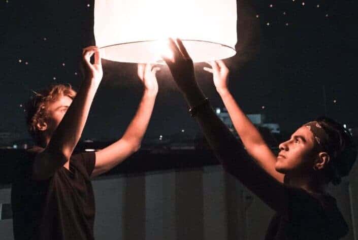 Friends preparing a sky lantern 