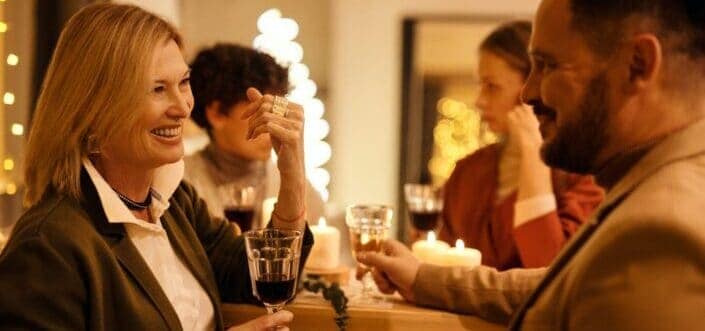 Man and a woman having conversation while drinking wine