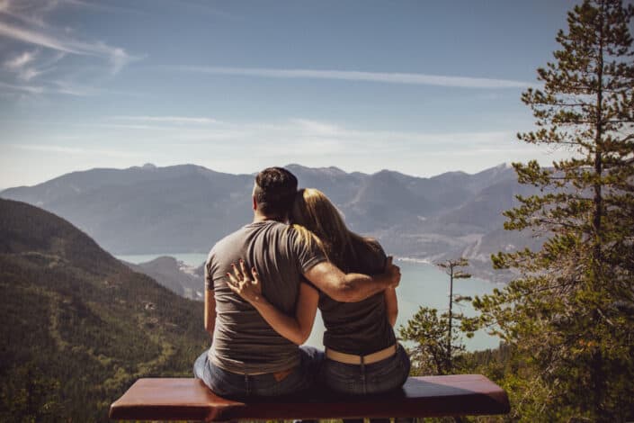 Couple hugging while enjoying the beautiful view
