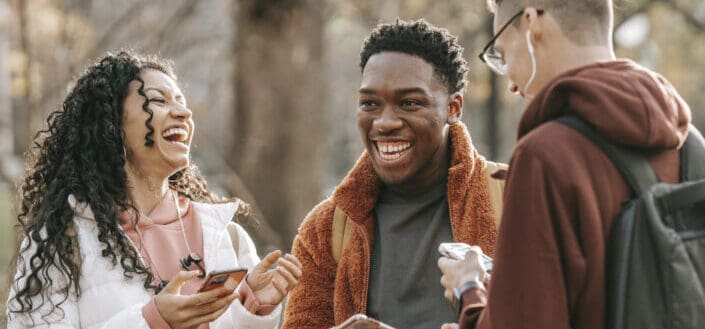 Three friends laughing together