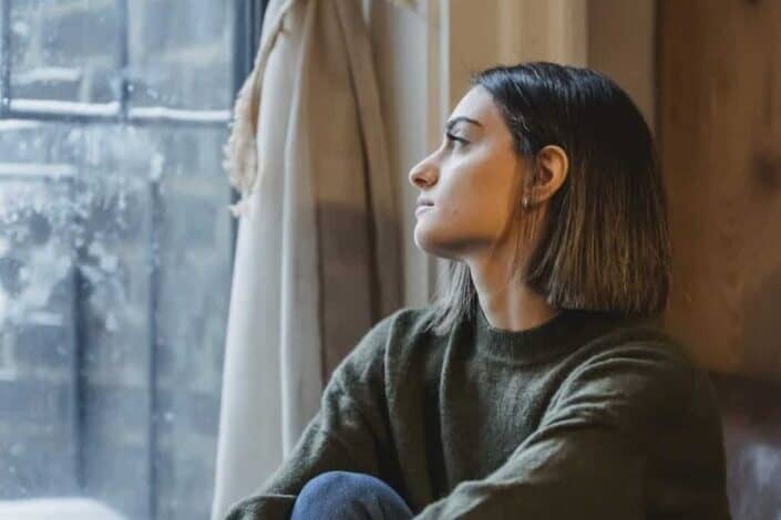 Woman gazing at the window