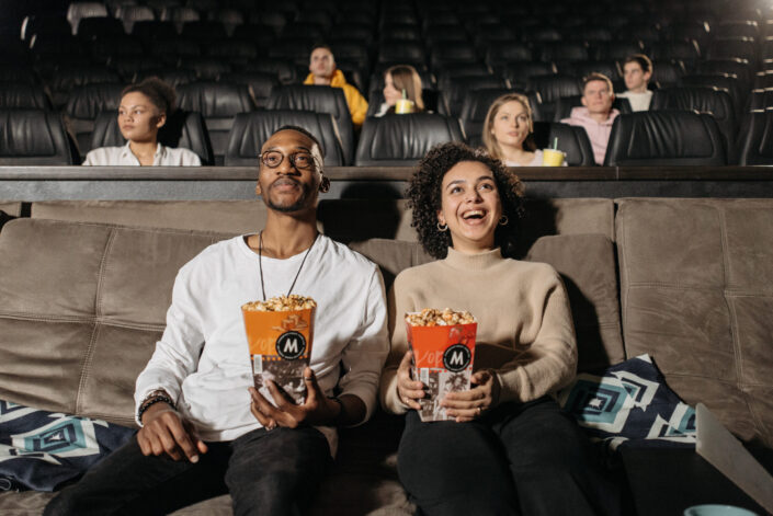 couple watching cinema enthusiastically