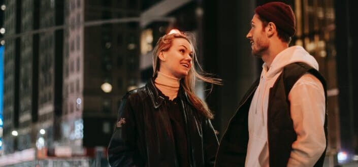 Couple talking in the streets at night