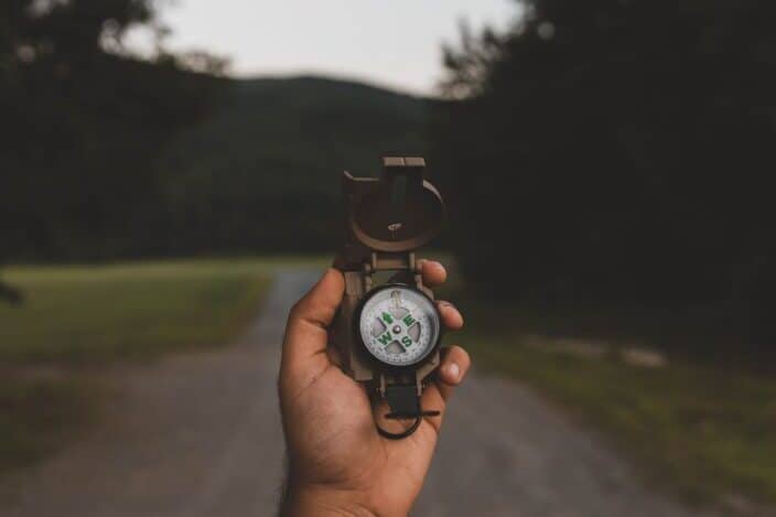 Man holding a compass