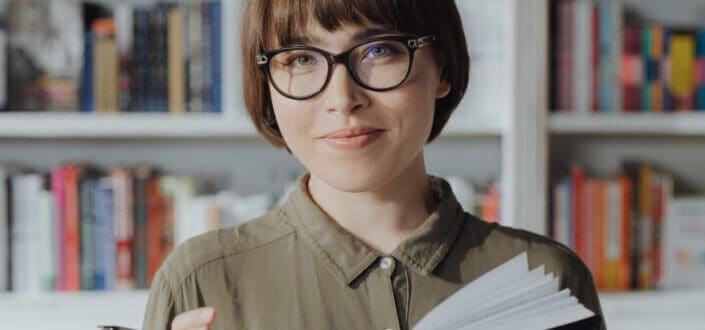 Young lady in sunglasses smiling