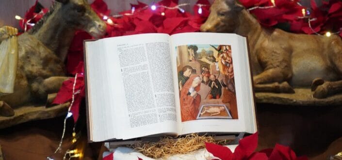 Bible seated on a Christmas theme designed shelf.