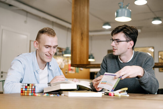 Two guys doing a bible study together - Christmas bible trivia