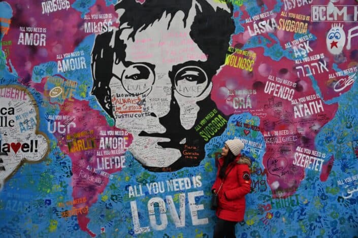 Woman mesmerizing the beatles street art