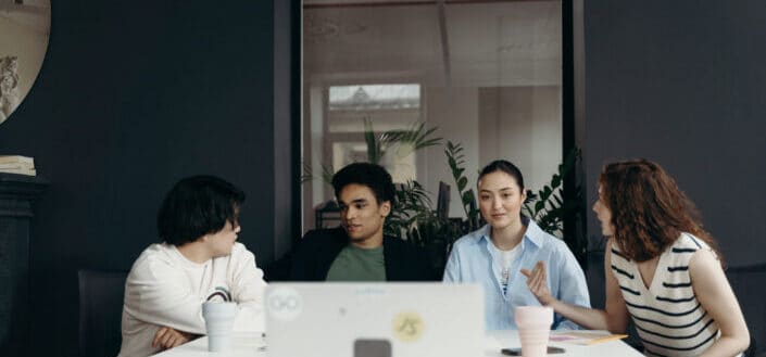 People having their meeting in their office.