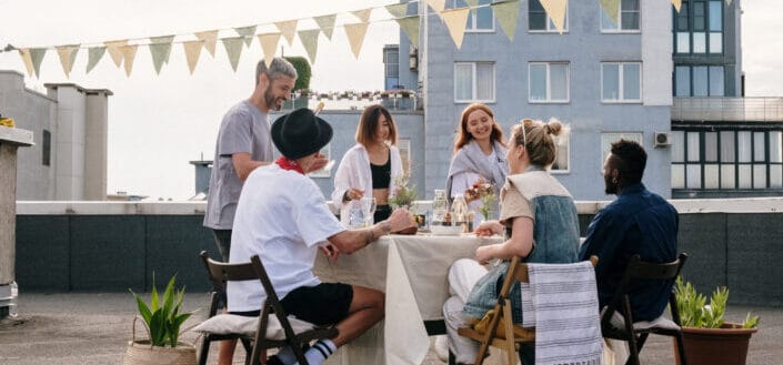 Friends catching up on a rooftop