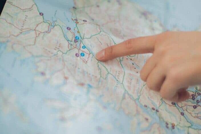 Person pointing at the map