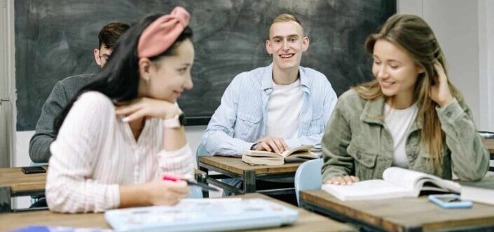 four people in a classroom