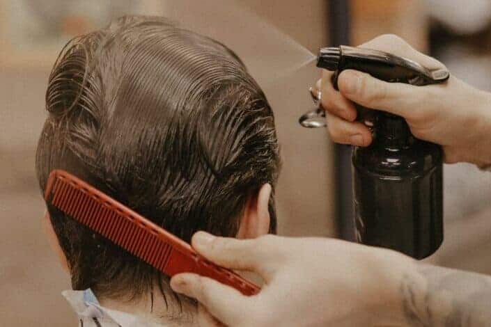 Man combing his customers hair