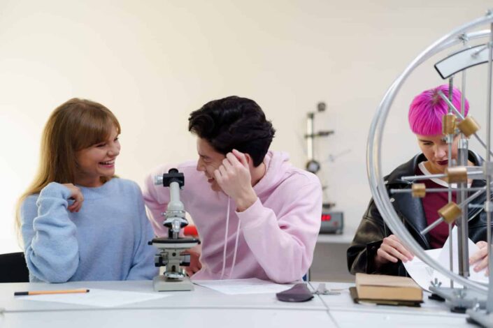 Classmates flirting in their laboratory area.