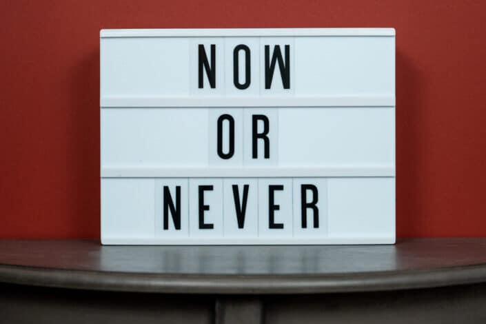 Now or Never on a sign board.