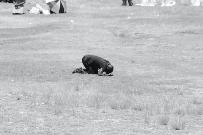 Man bowing on the ground
