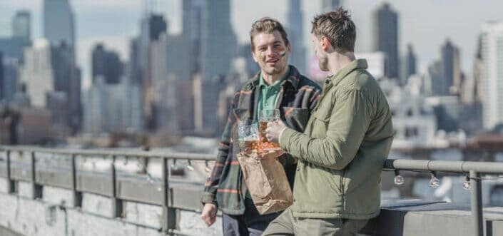 two friends talking outdoors